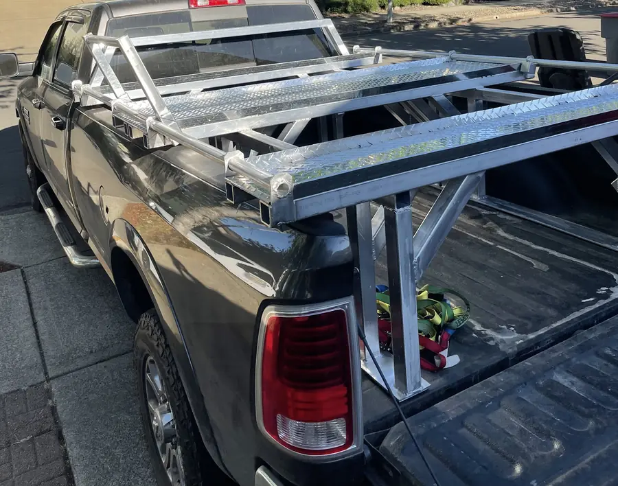 Empty aluminum ATV rack built over a pickup bed