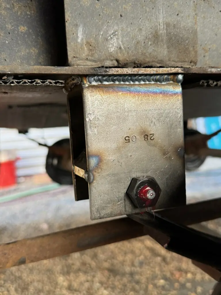 New spring hanger welded to the RV frame, bolt back in place